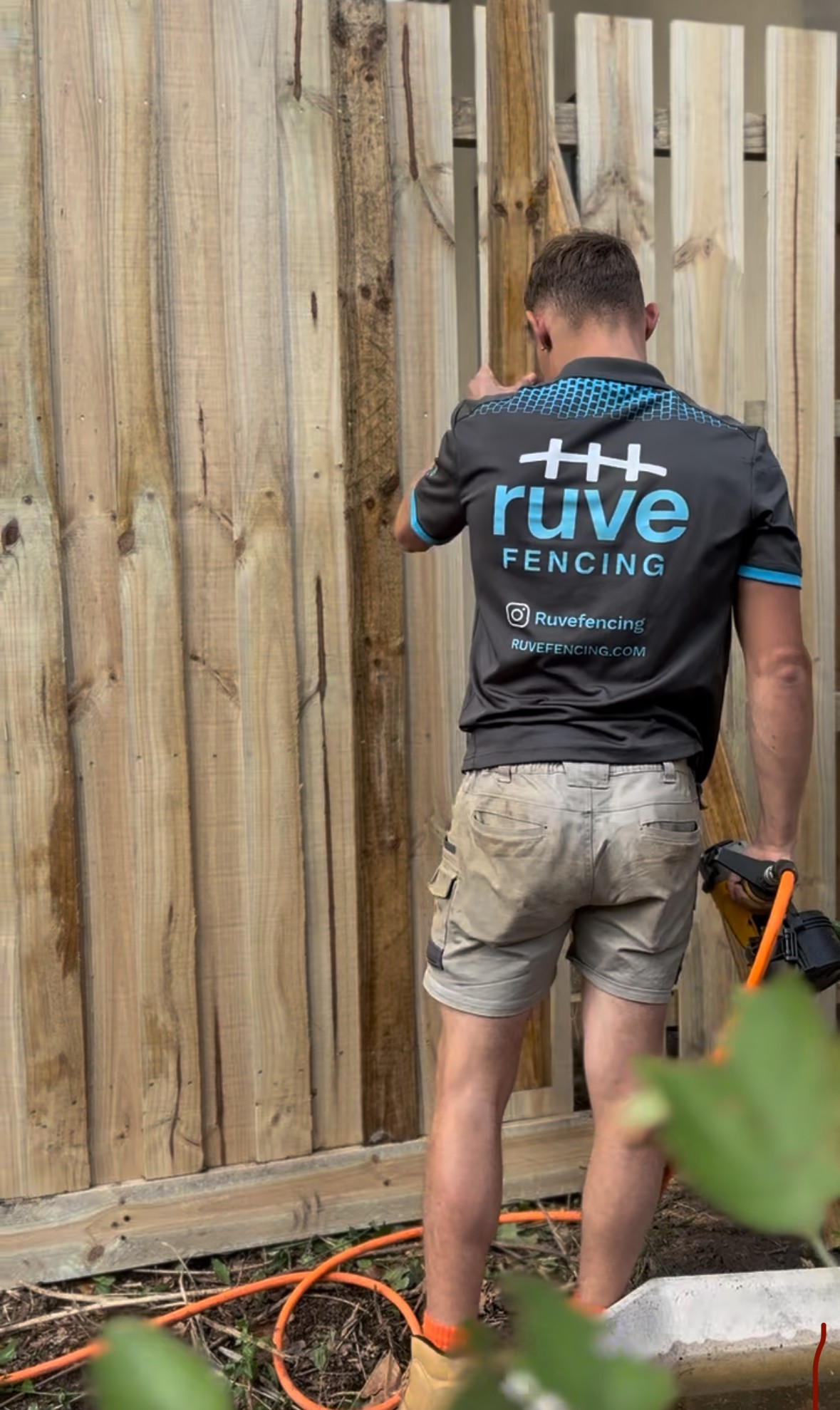 Louis, owner of Ruve Fencing Melbourne, building a timber fence